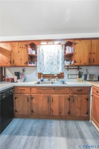 a kitchen with stainless steel appliances granite countertop a stove and cabinets