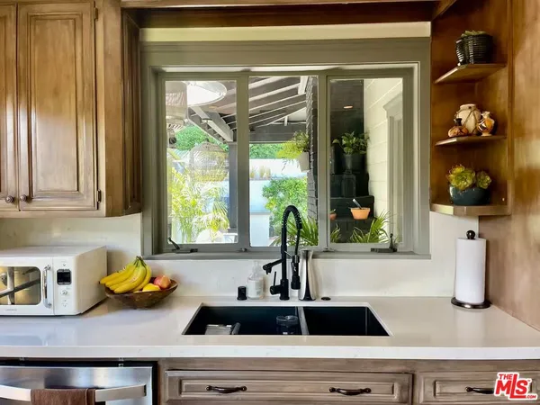 a kitchen with a sink and a window