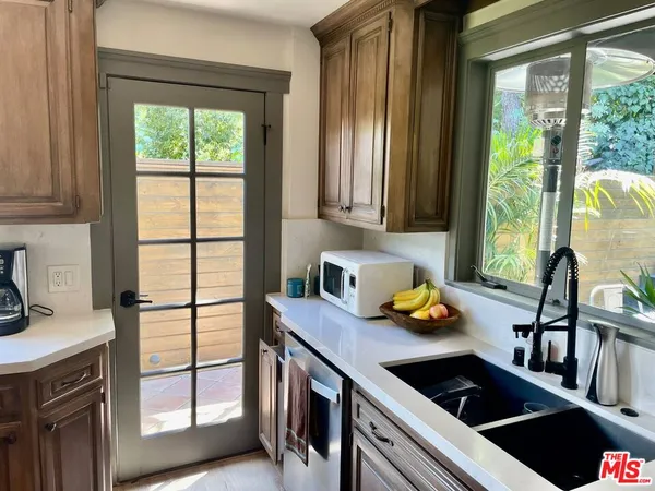 a kitchen with a stove and a sink