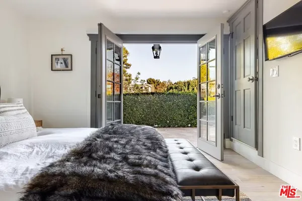 a view of a livingroom with furniture and windows