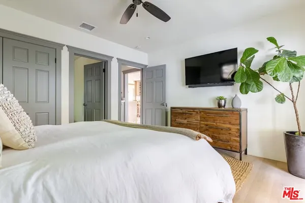 a bedroom with a bed and a view of bathroom