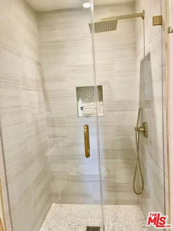 a living room with furniture large window and fireplace