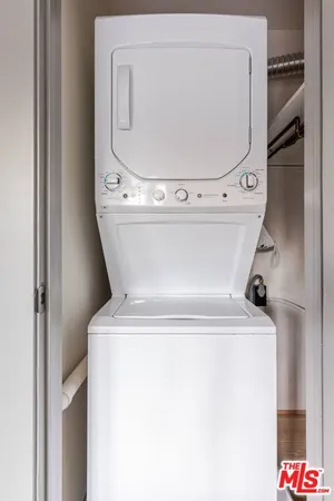 a view of a roof deck with furniture