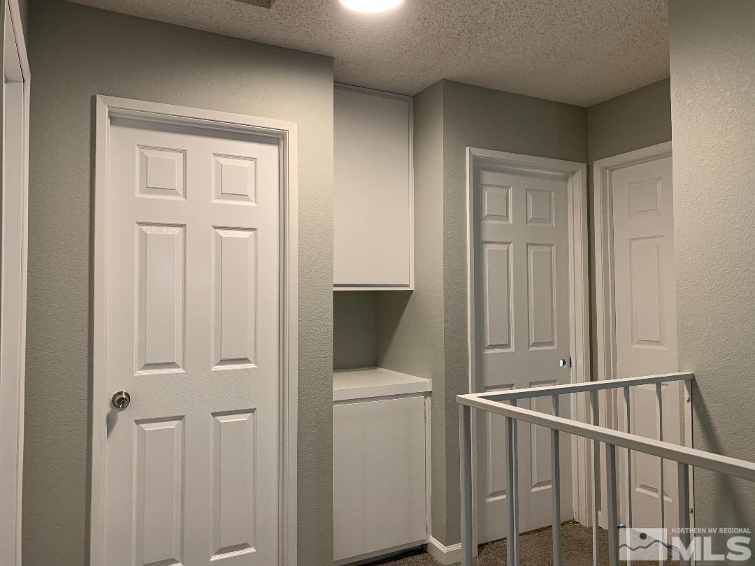 10042 Humite Lane Reno, NV 89506 - Photo 3 of 3 a view of a hallway with bathroom