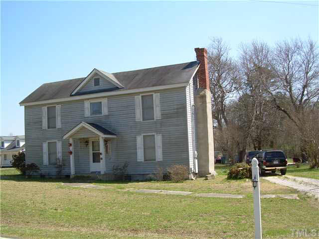 1424 Sykes Road Spring Hope, NC 27882 - Photo 1 of 9 a front view of a house with garden