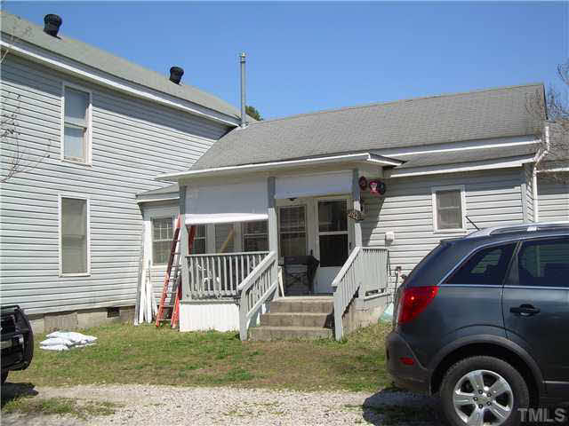 1424 Sykes Road Spring Hope, NC 27882 - Photo 2 of 9 a view of a car park side of a house