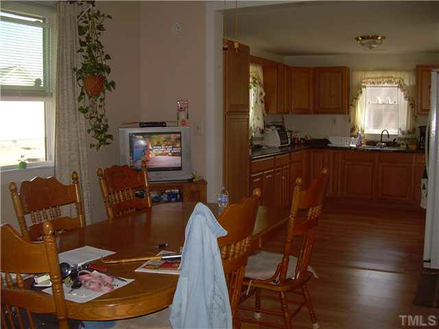 1424 Sykes Road Spring Hope, NC 27882 - Photo 6 of 9 a kitchen with granite countertop lots of appliances and furniture