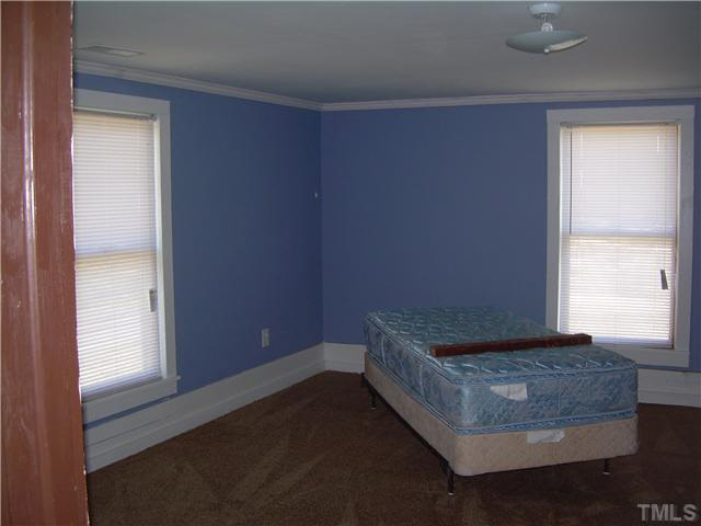 1424 Sykes Road Spring Hope, NC 27882 - Photo 8 of 9 a living room with hard wood floor and a window