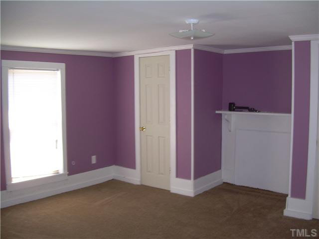 1424 Sykes Road Spring Hope, NC 27882 - Photo 9 of 9 an empty room with windows