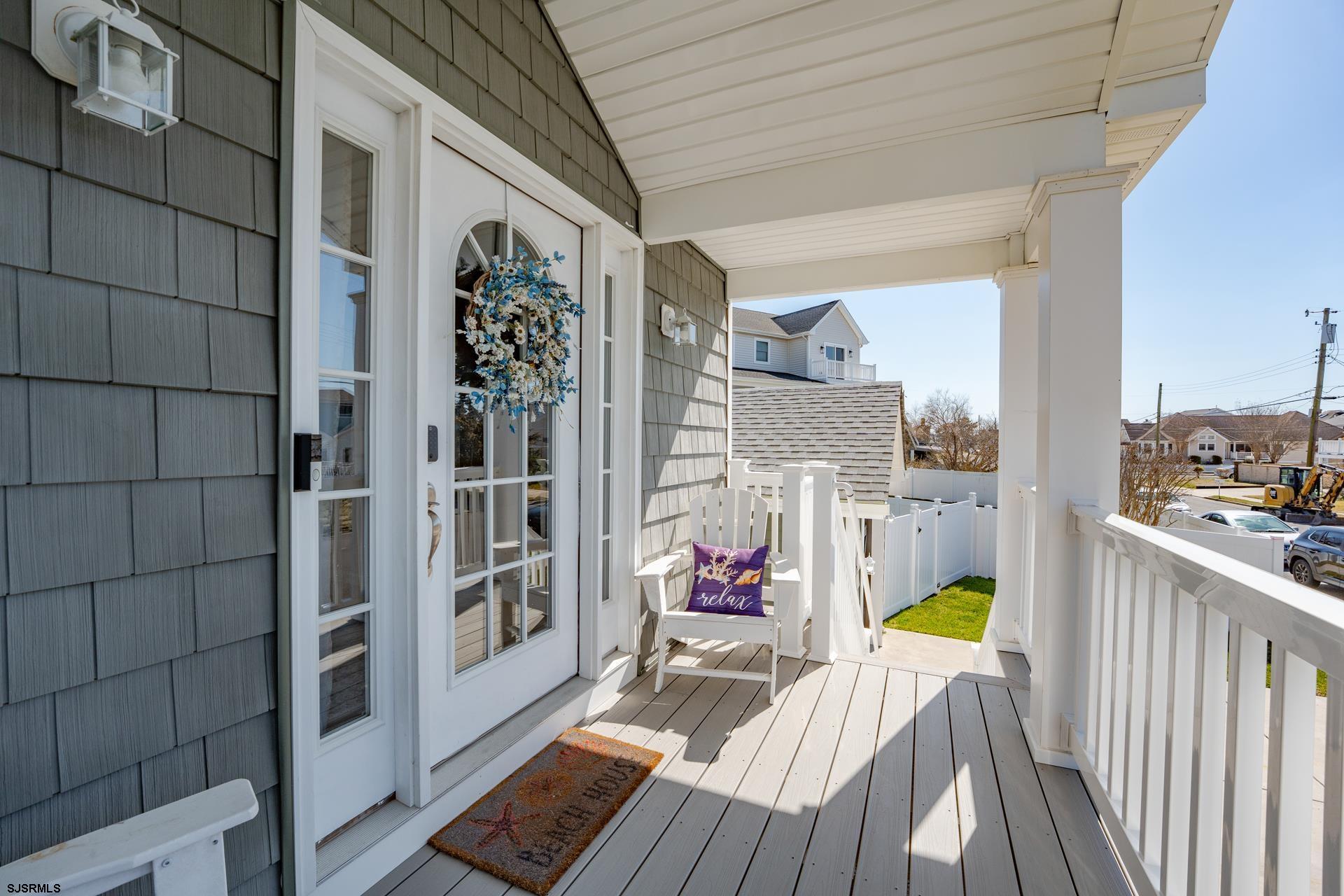 703 Bobby Jones Road Brigantine, NJ 08203 - Photo 23 of 34 a view of a balcony with wooden floor and outdoor space