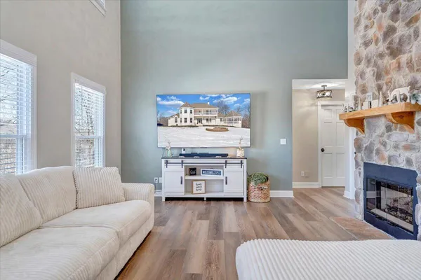 a view of a dining room with furniture wooden floor and chandelier