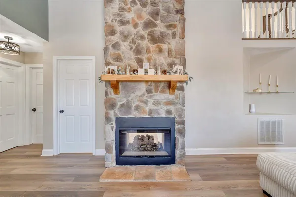 a bathroom with a toilet a sink and a window