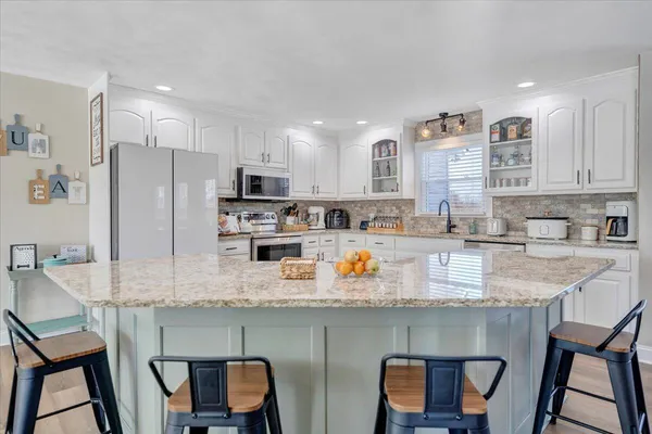a view of a hallway with a hardwood floor