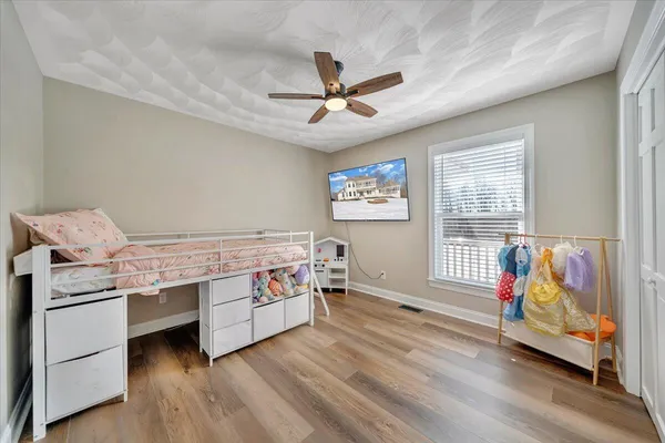 a view of roof deck with a barbeque and wooden stairs