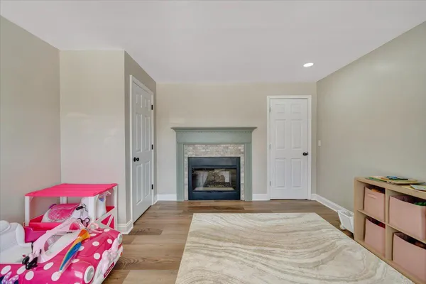 a view of a house with snow on the road