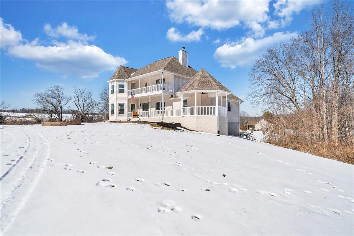 10 Wilkerson Road Wirtz, VA 24184 - Photo 80 of 89 a view of a white house with a snow in the yard