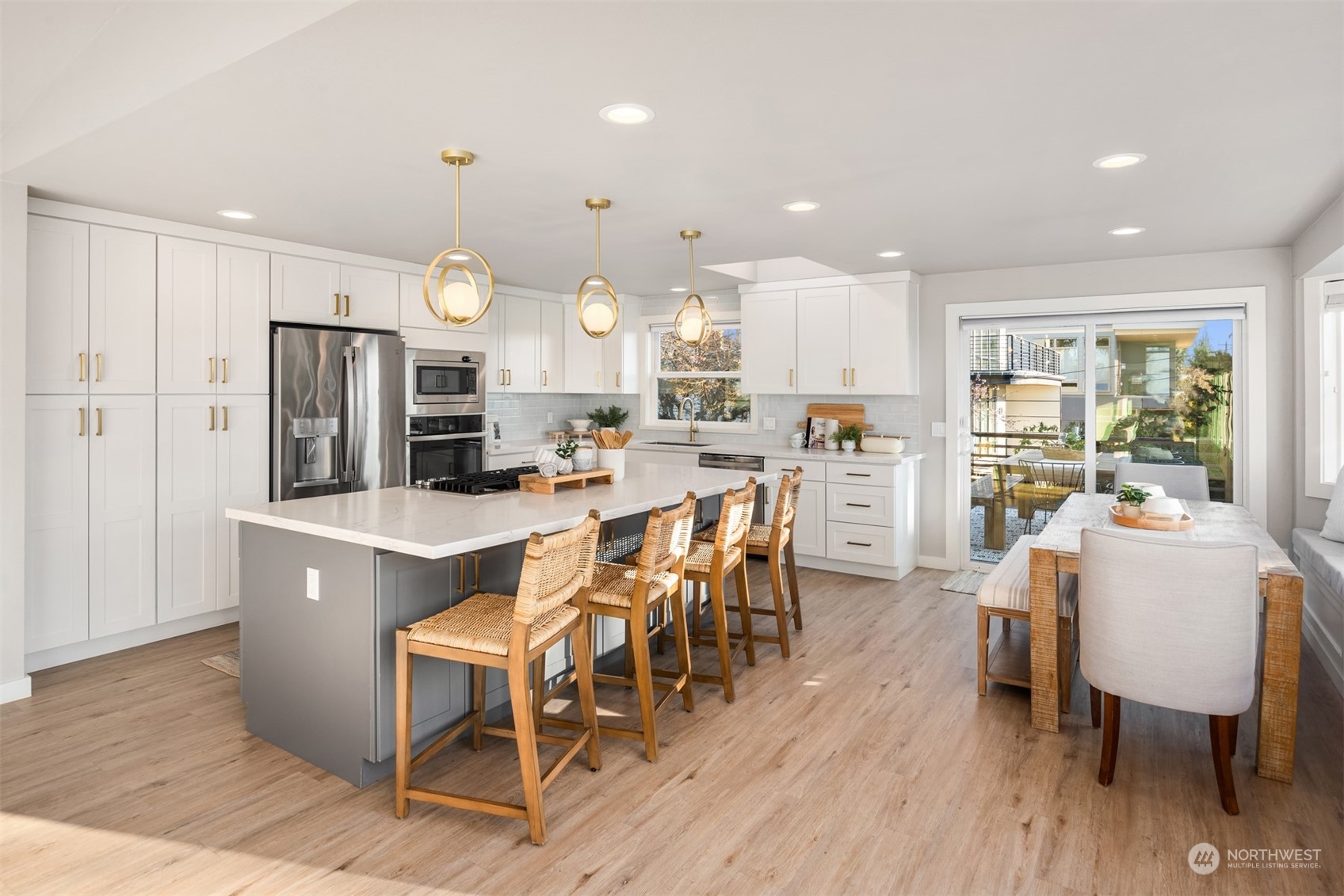 917 9th Avenue South Edmonds, WA 98020 - Photo 11 of 40 a view of a dining room with furniture window and wooden floor