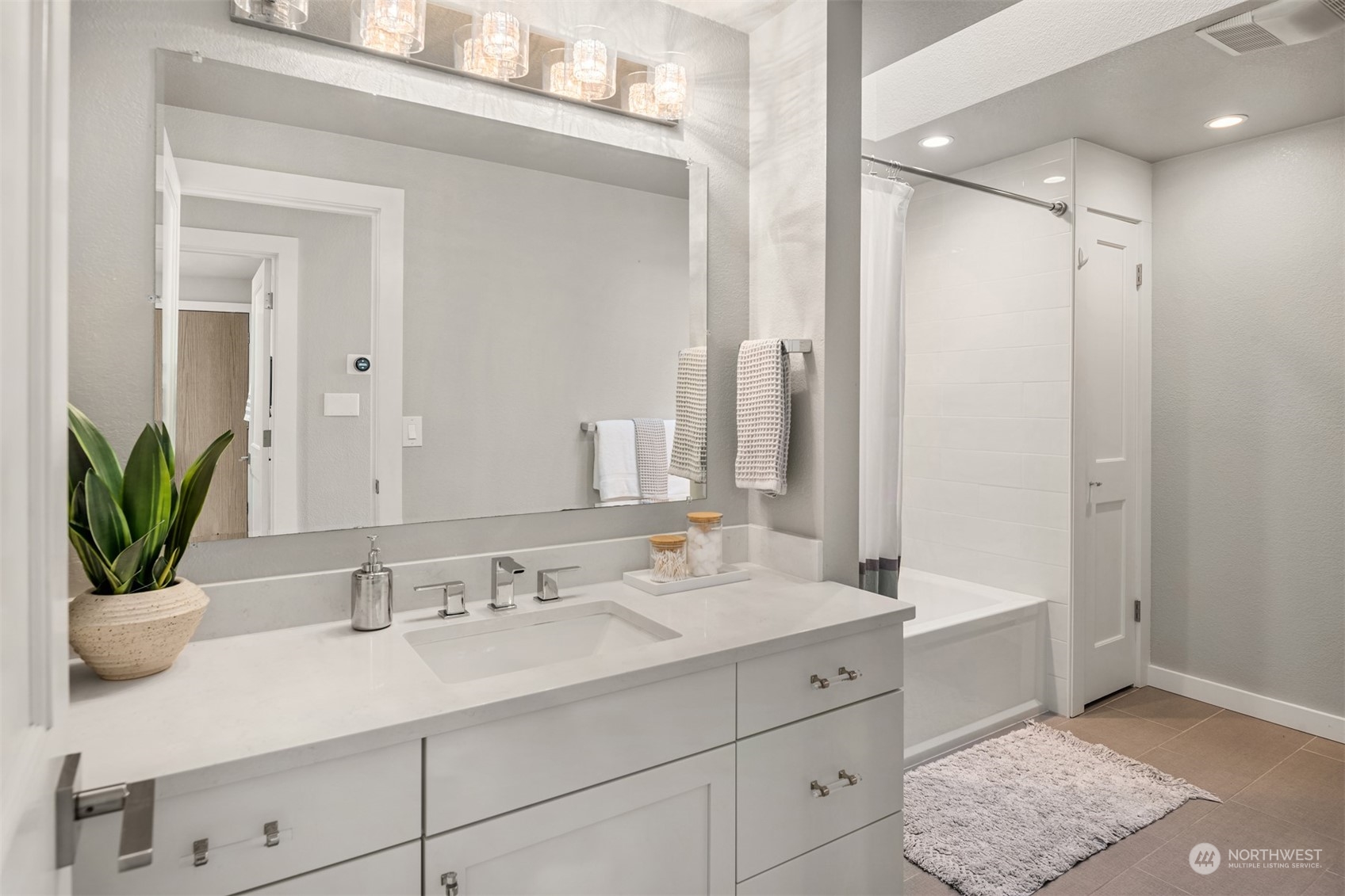 917 9th Avenue South Edmonds, WA 98020 - Photo 21 of 40 a bathroom with a sink and a mirror