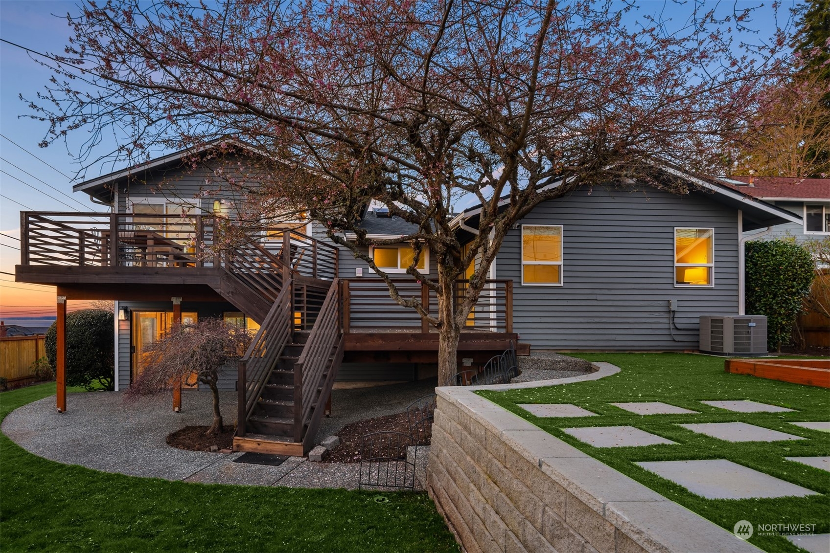 917 9th Avenue South Edmonds, WA 98020 - Photo 32 of 40 a view of a house with a yard fire pit and a large tree