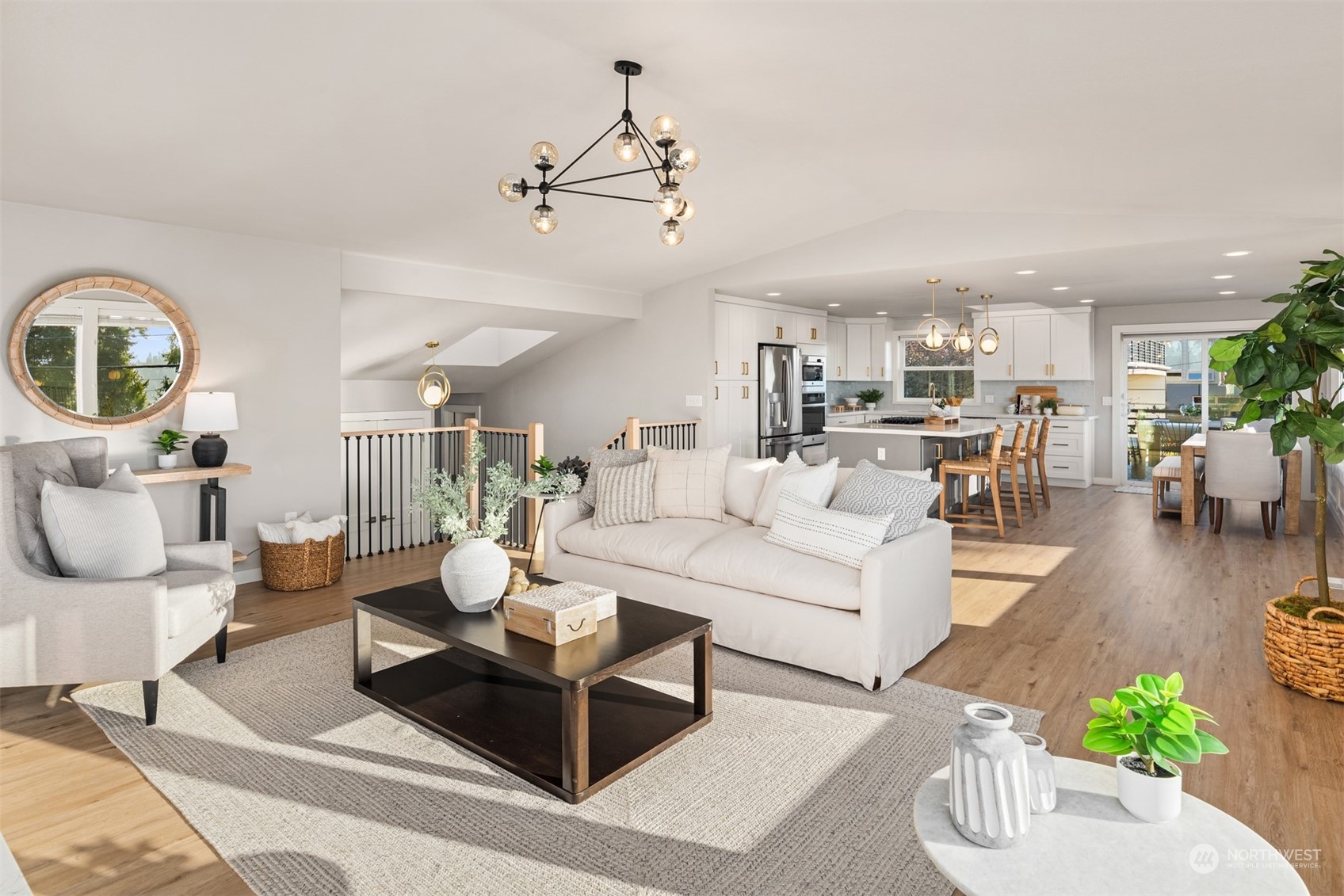 917 9th Avenue South Edmonds, WA 98020 - Photo 10 of 40 a living room with furniture a rug and a chandelier