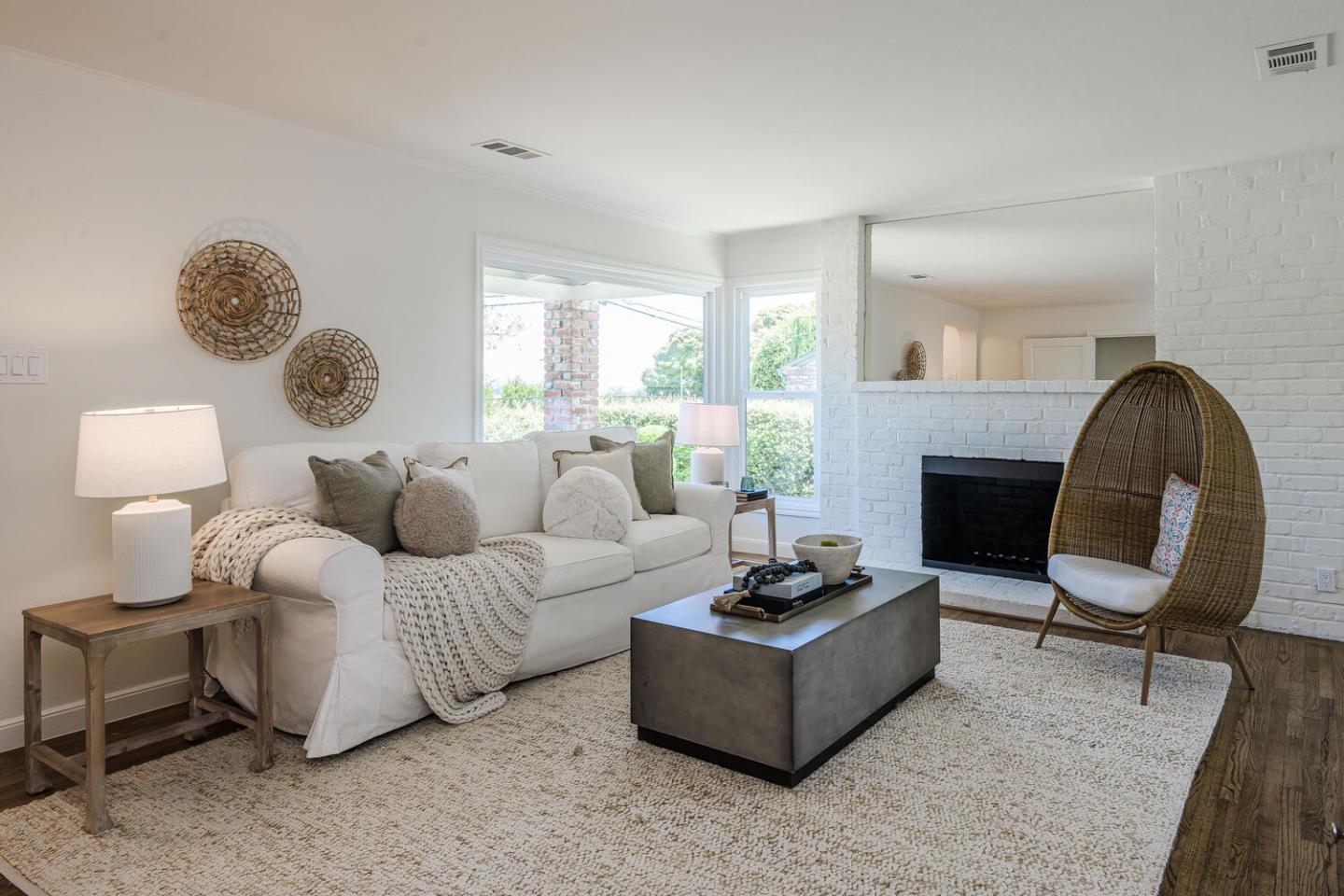 367 Millwood Drive Millbrae, CA 94030 - Photo 6 of 25 a living room with furniture a fireplace and a large window