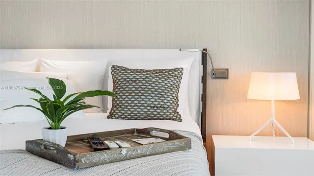 a bed room with a bed and a large window