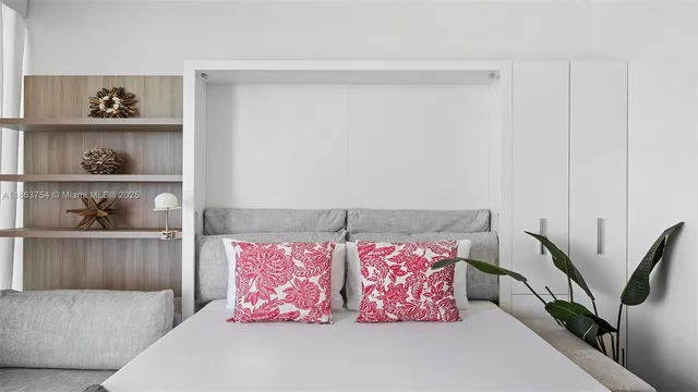 a living room with furniture and large windows