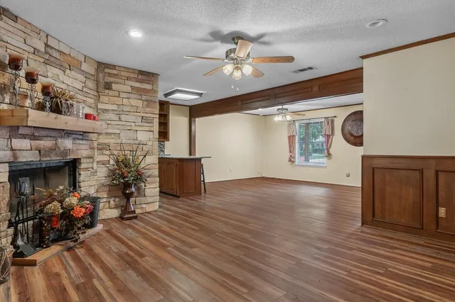 a view of a kitchen with a sink and a fireplace