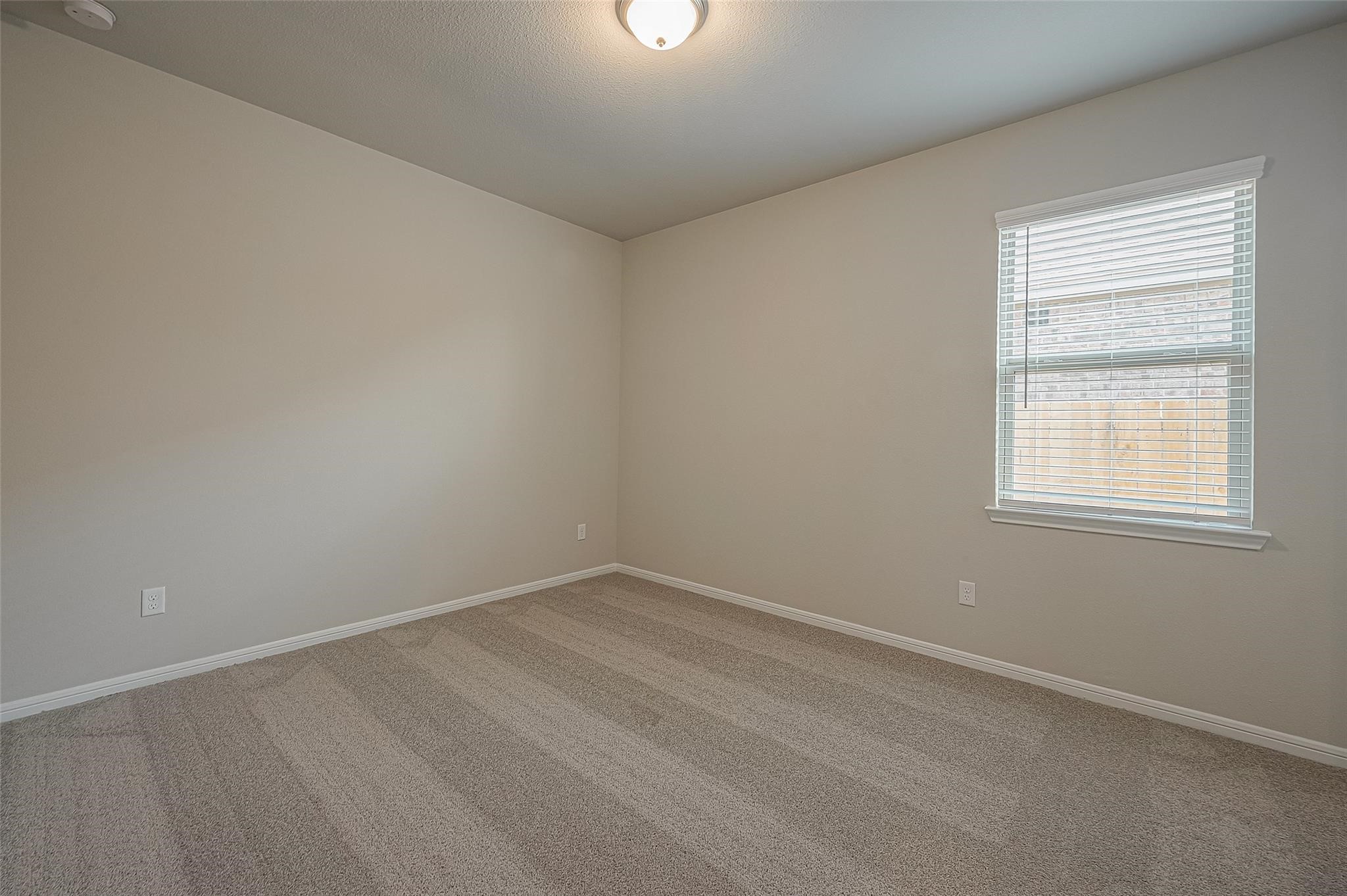 13306 Prado Rdg Lane Iowa Colony, TX 77583 - Photo 20 of 42 an empty room with a window