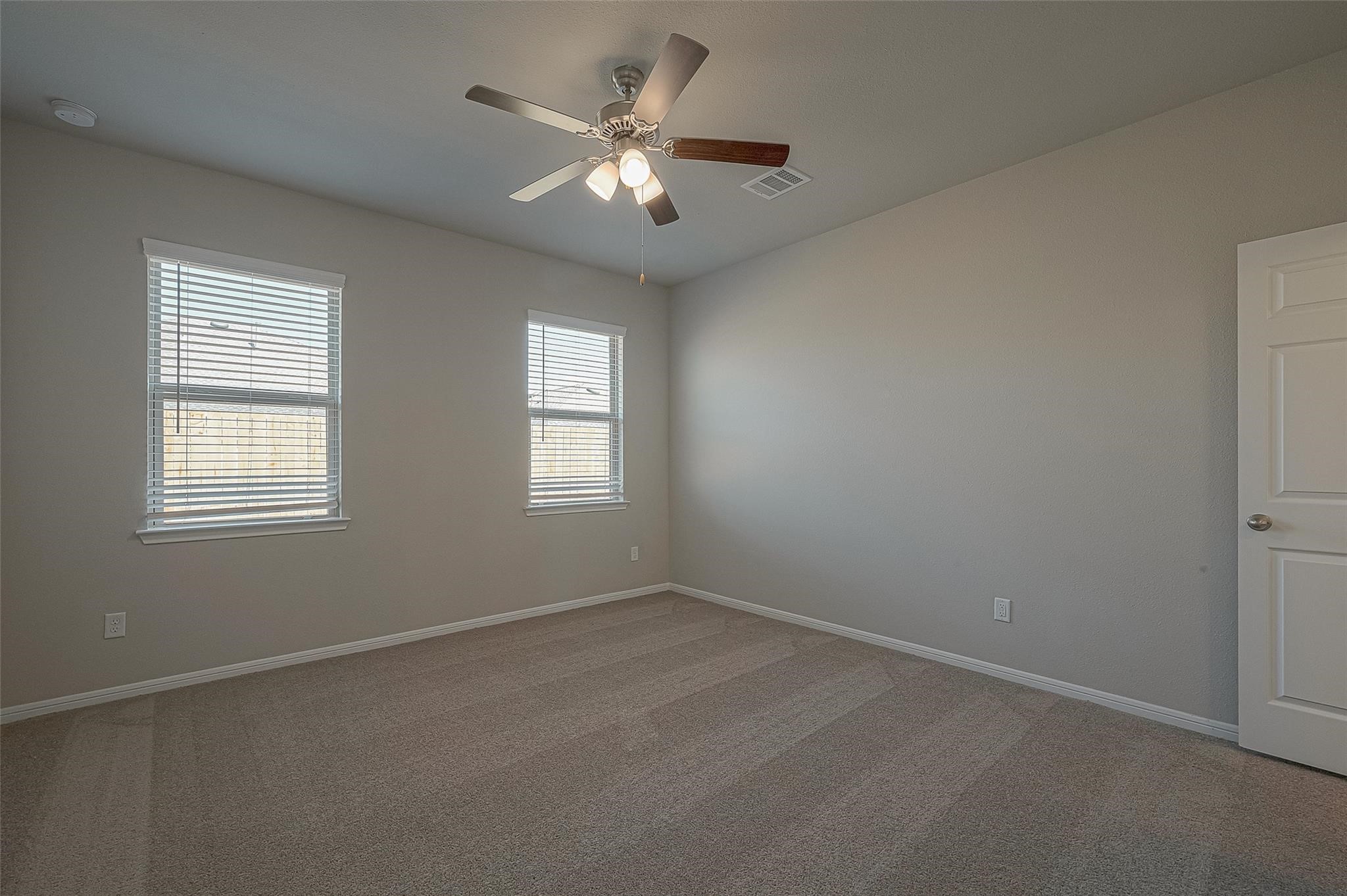 13306 Prado Rdg Lane Iowa Colony, TX 77583 - Photo 25 of 42 an empty room with a window