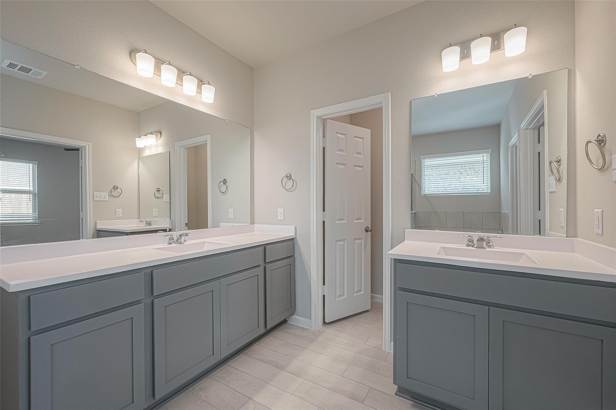 13306 Prado Rdg Lane Iowa Colony, TX 77583 - Photo 30 of 42 a bathroom with double sink and mirror