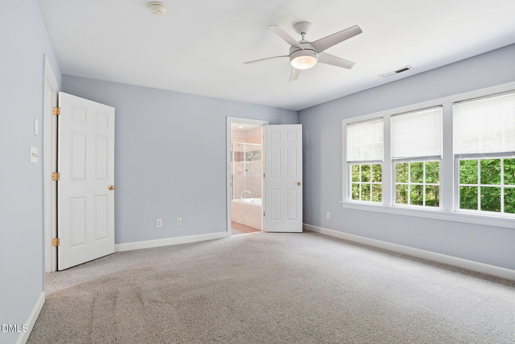 7 Morgans Ridge Lane Durham, NC 27707 - Photo 48 of 75 an empty room with windows and ceiling fan