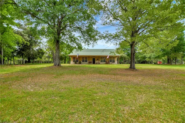 a view of a house with a big yard