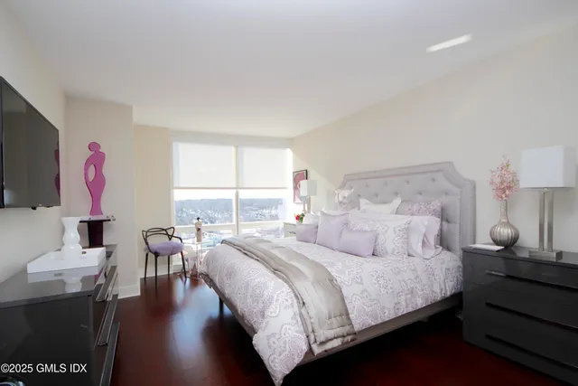 a bedroom with a bed and a table