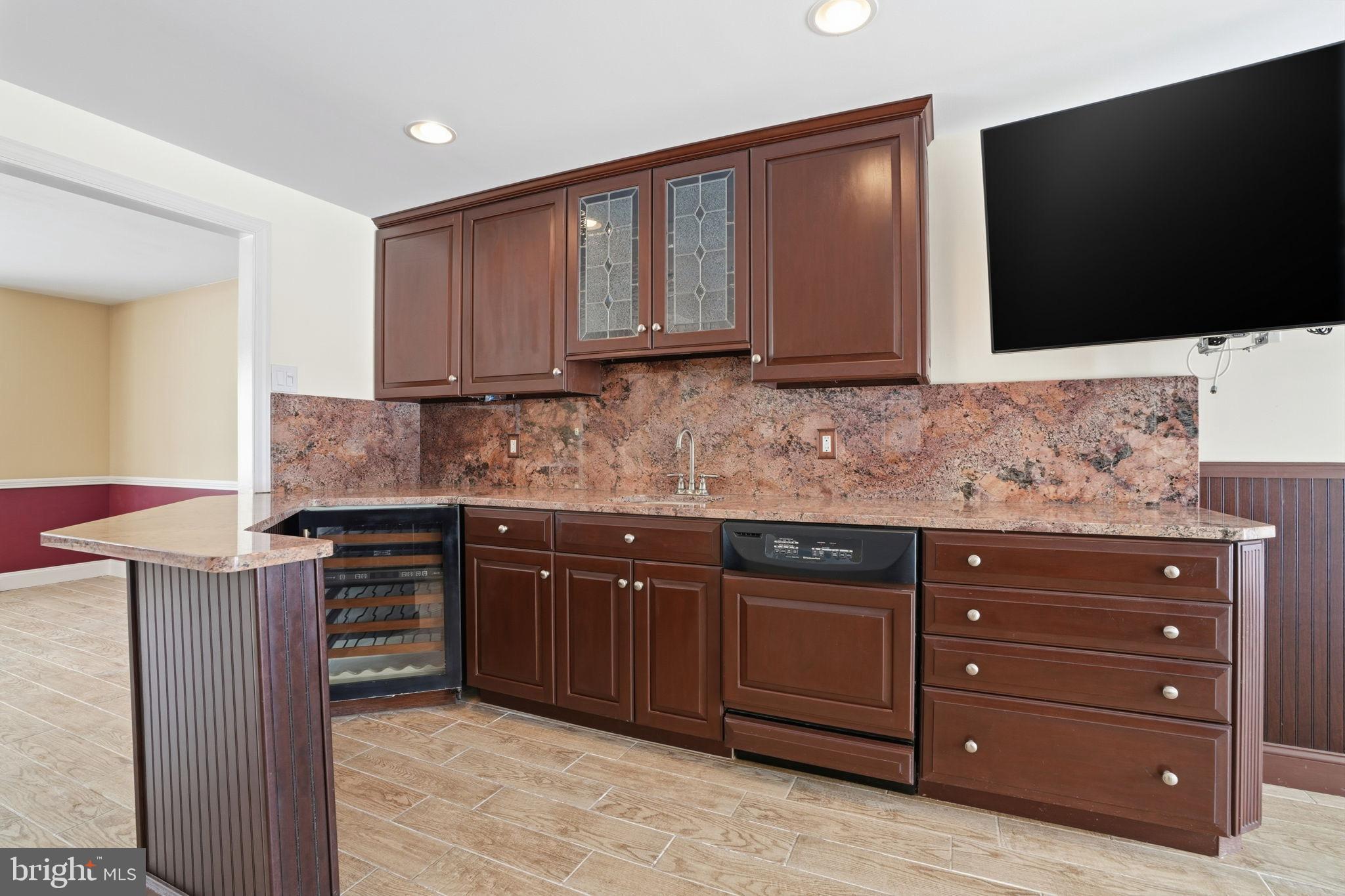 32 Lower Hilltop Road Yardley, PA 19067 - Photo 11 of 37 a kitchen with stainless steel appliances granite countertop a sink stove and microwave