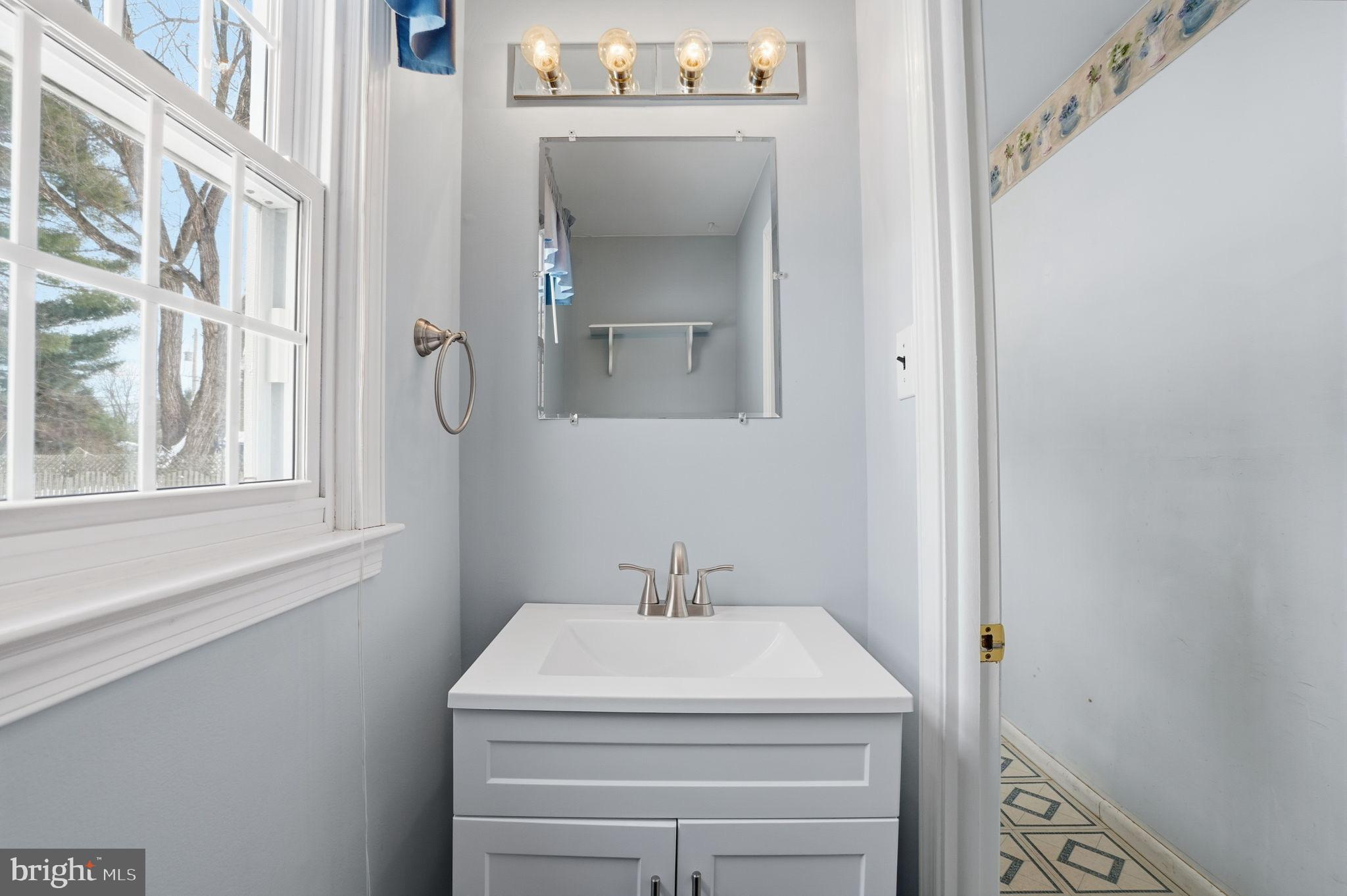 32 Lower Hilltop Road Yardley, PA 19067 - Photo 26 of 37 a bathroom with a sink and a mirror