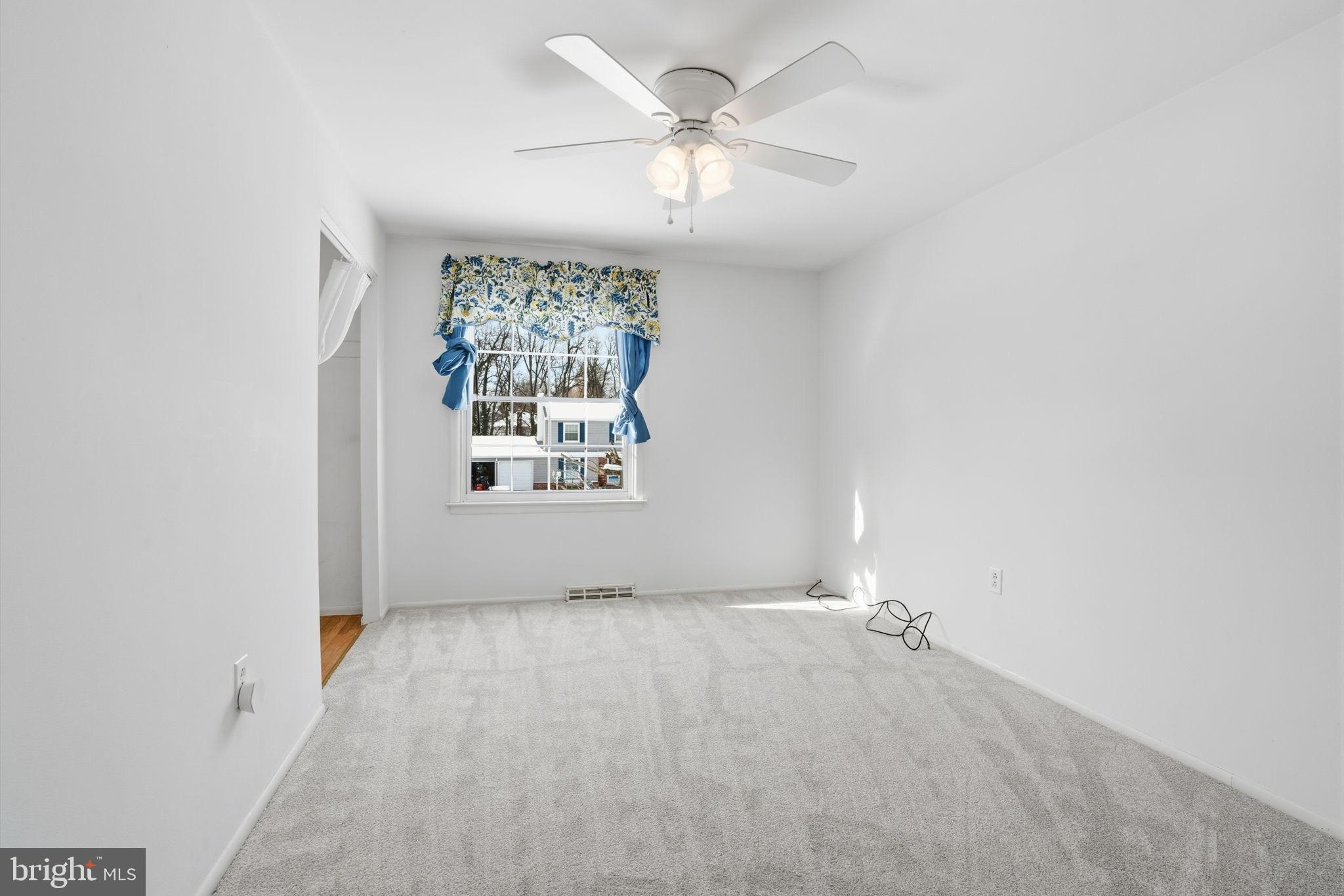 32 Lower Hilltop Road Yardley, PA 19067 - Photo 29 of 37 an empty room with windows and fan