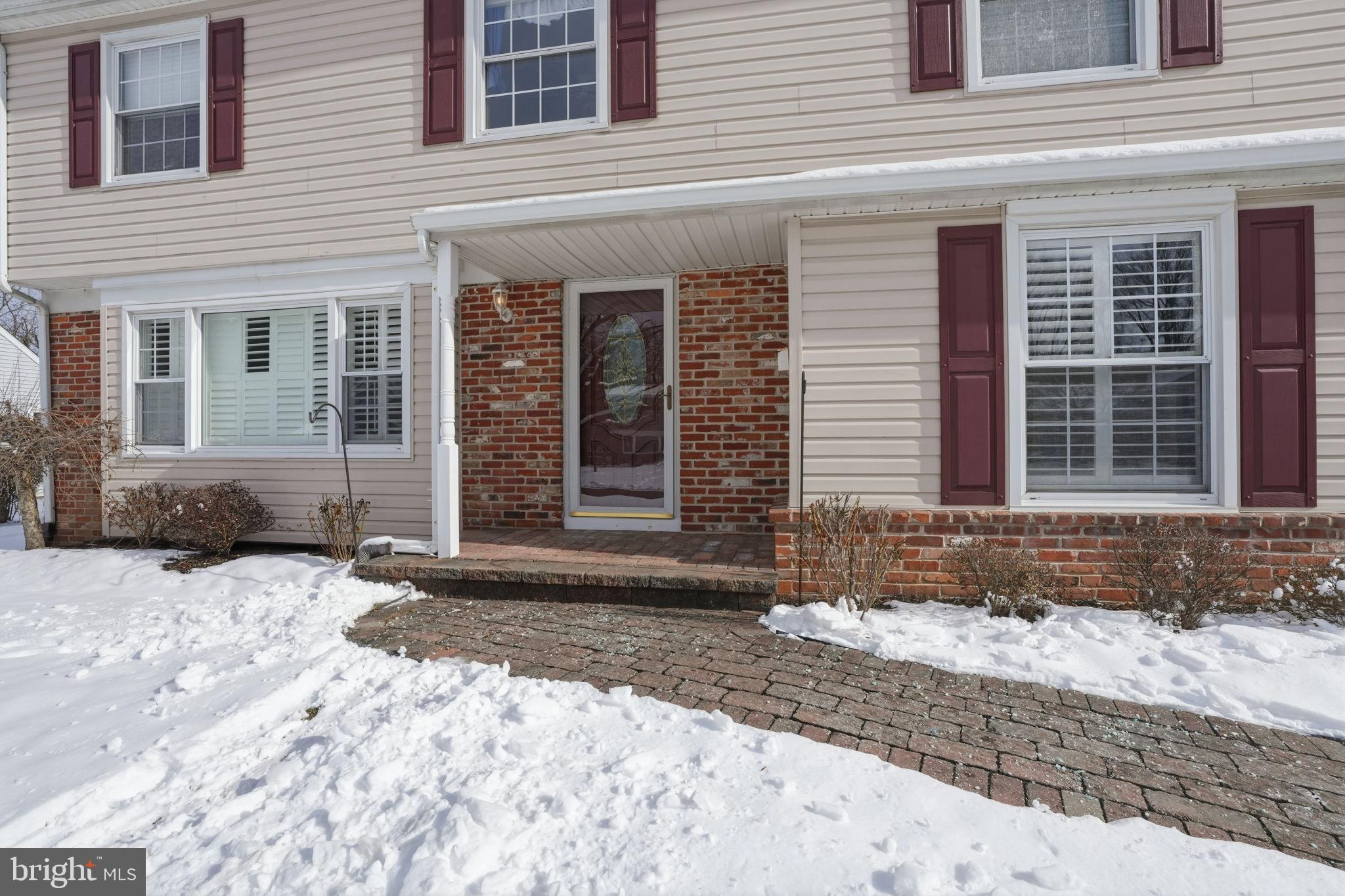 32 Lower Hilltop Road Yardley, PA 19067 - Photo 6 of 37 a view of a brick house with a yard