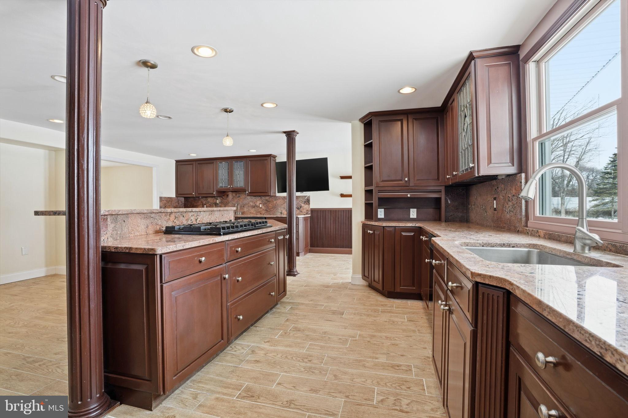 32 Lower Hilltop Road Yardley, PA 19067 - Photo 10 of 37 a kitchen with stainless steel appliances granite countertop a stove sink and cabinets