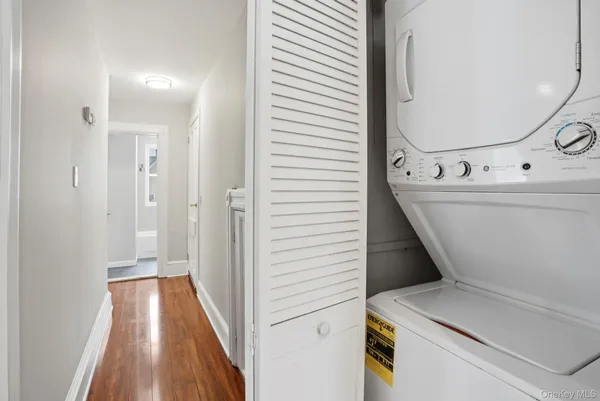 a view of a hallway with washer and dryer