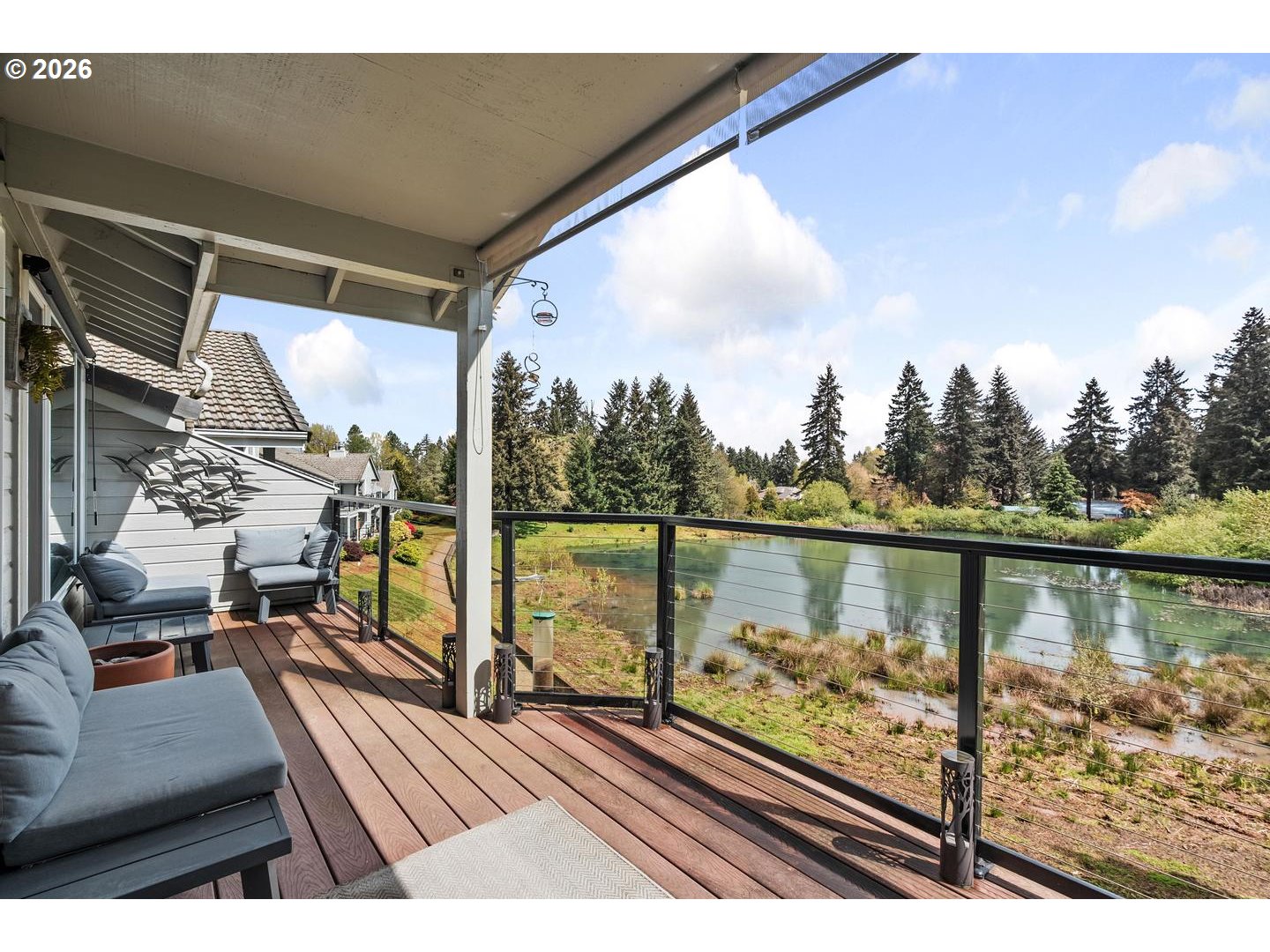 1840 Rees Hill Road Southeast, Unit 19 Salem, OR 97306 - Photo 21 of 34 a view of a balcony with wooden floor and outdoor seating