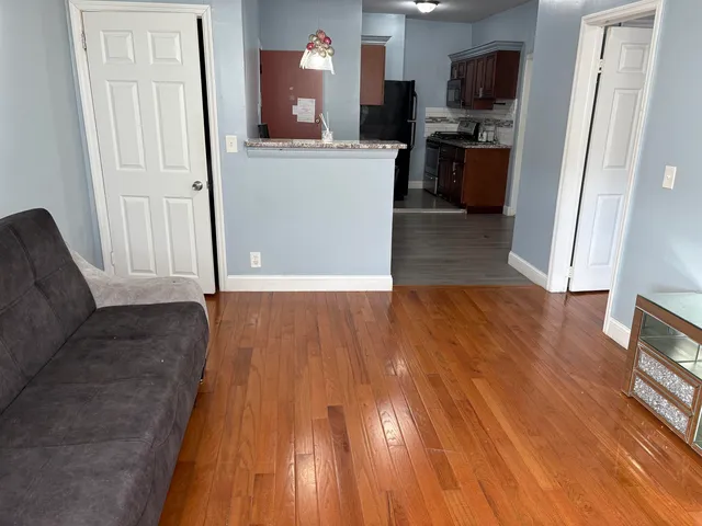 a view of a kitchen from a hallway