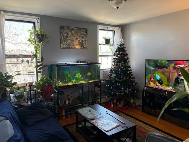 a living room with furniture and a flat screen tv
