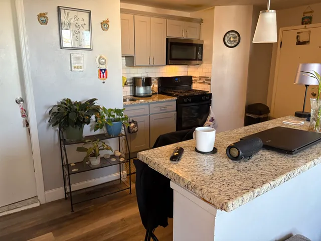 a kitchen with sink and refrigerator