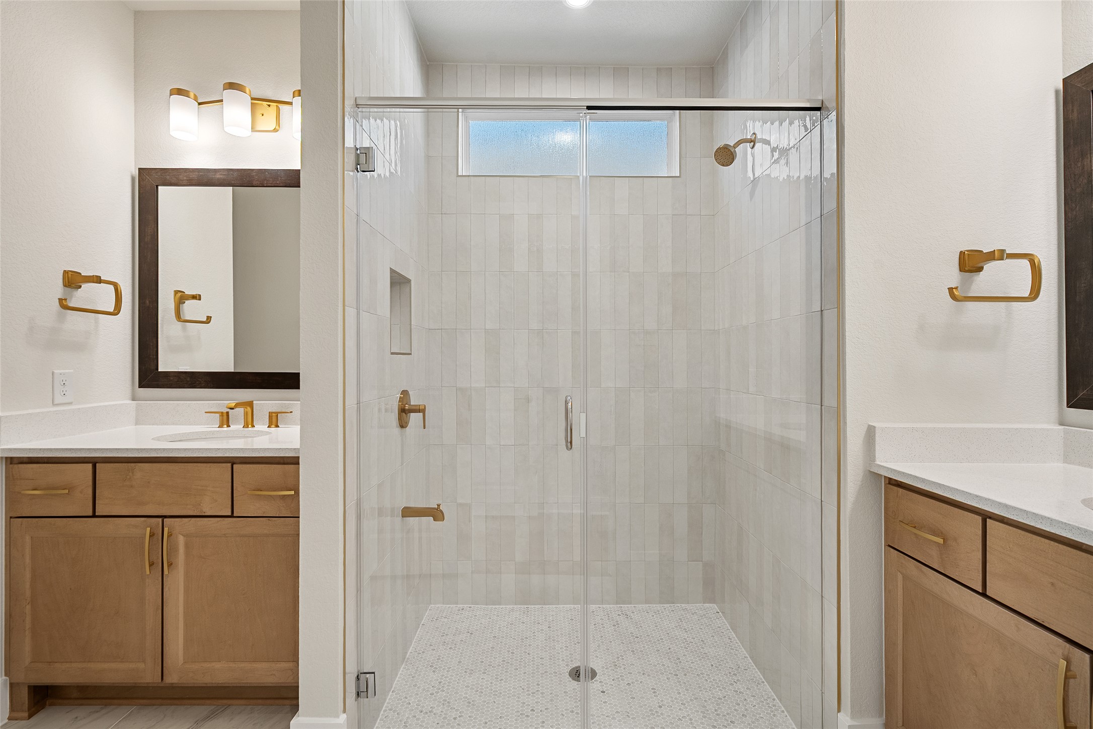 5336 Cosenza Trace Leander, TX 78641 - Photo 22 of 40 Full bathroom with two vanities and a shower stall