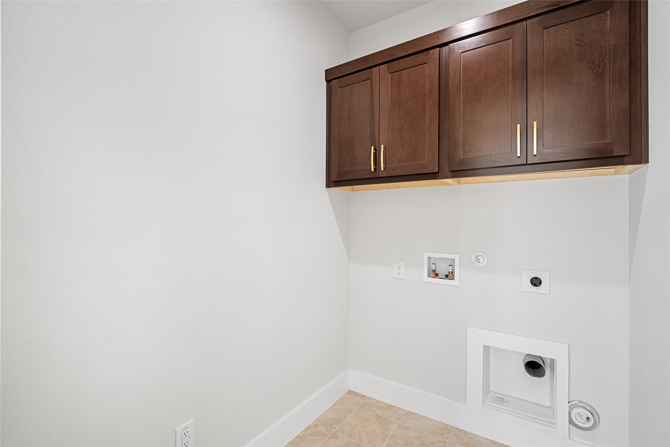 5336 Cosenza Trace Leander, TX 78641 - Photo 25 of 40 Laundry room with hookup for a gas dryer, hookup for a washing machine, cabinet space, and electric dryer hookup