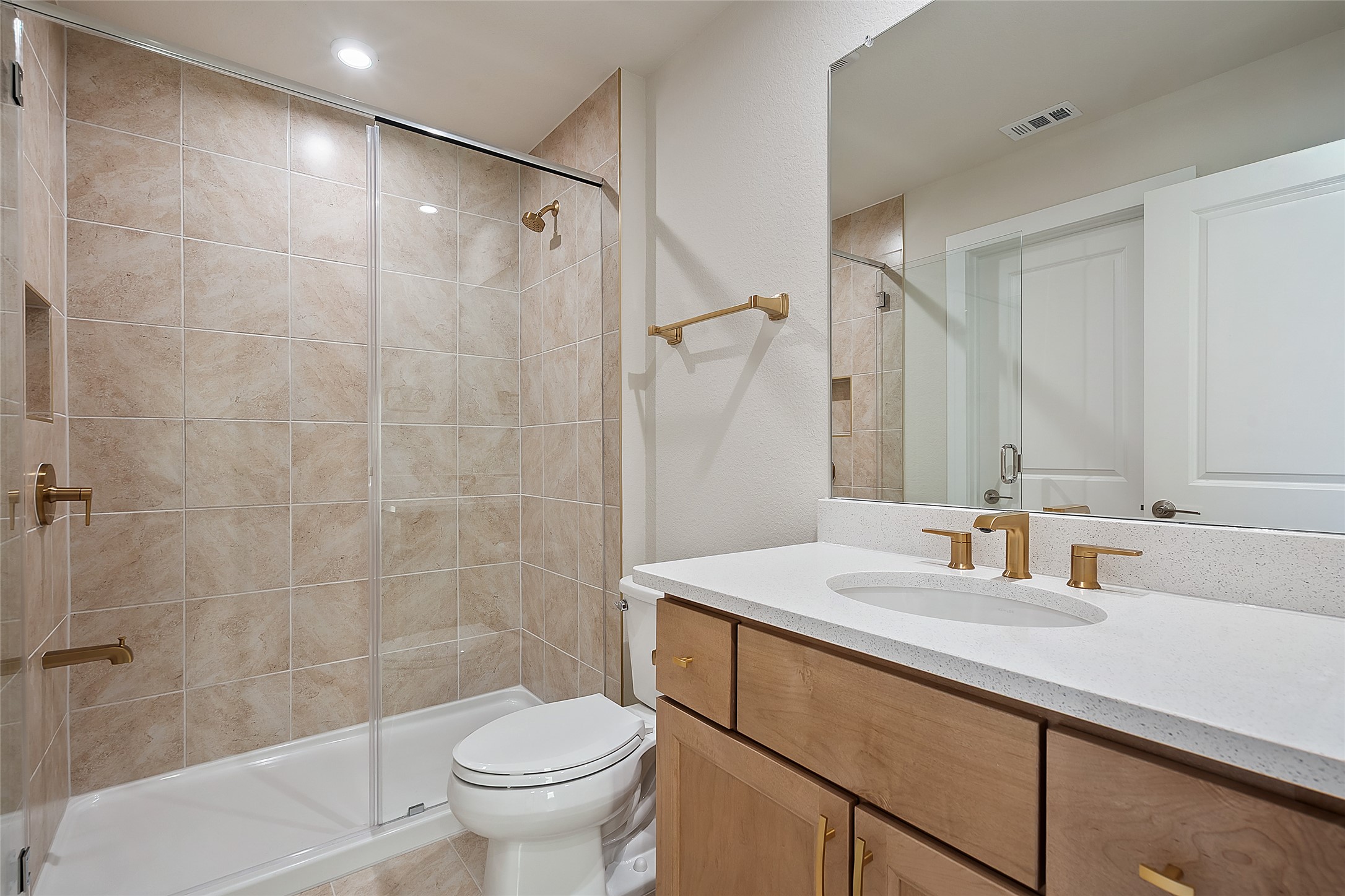 5336 Cosenza Trace Leander, TX 78641 - Photo 29 of 40 Full bath with vanity, a shower stall, and recessed lighting