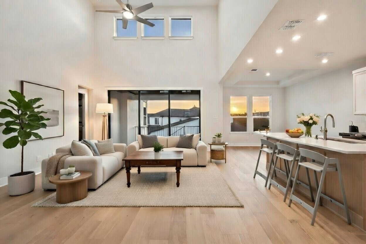 5336 Cosenza Trace Leander, TX 78641 - Photo 37 of 40 Living room featuring light wood-style flooring, a ceiling fan, recessed lighting, and a towering ceiling
