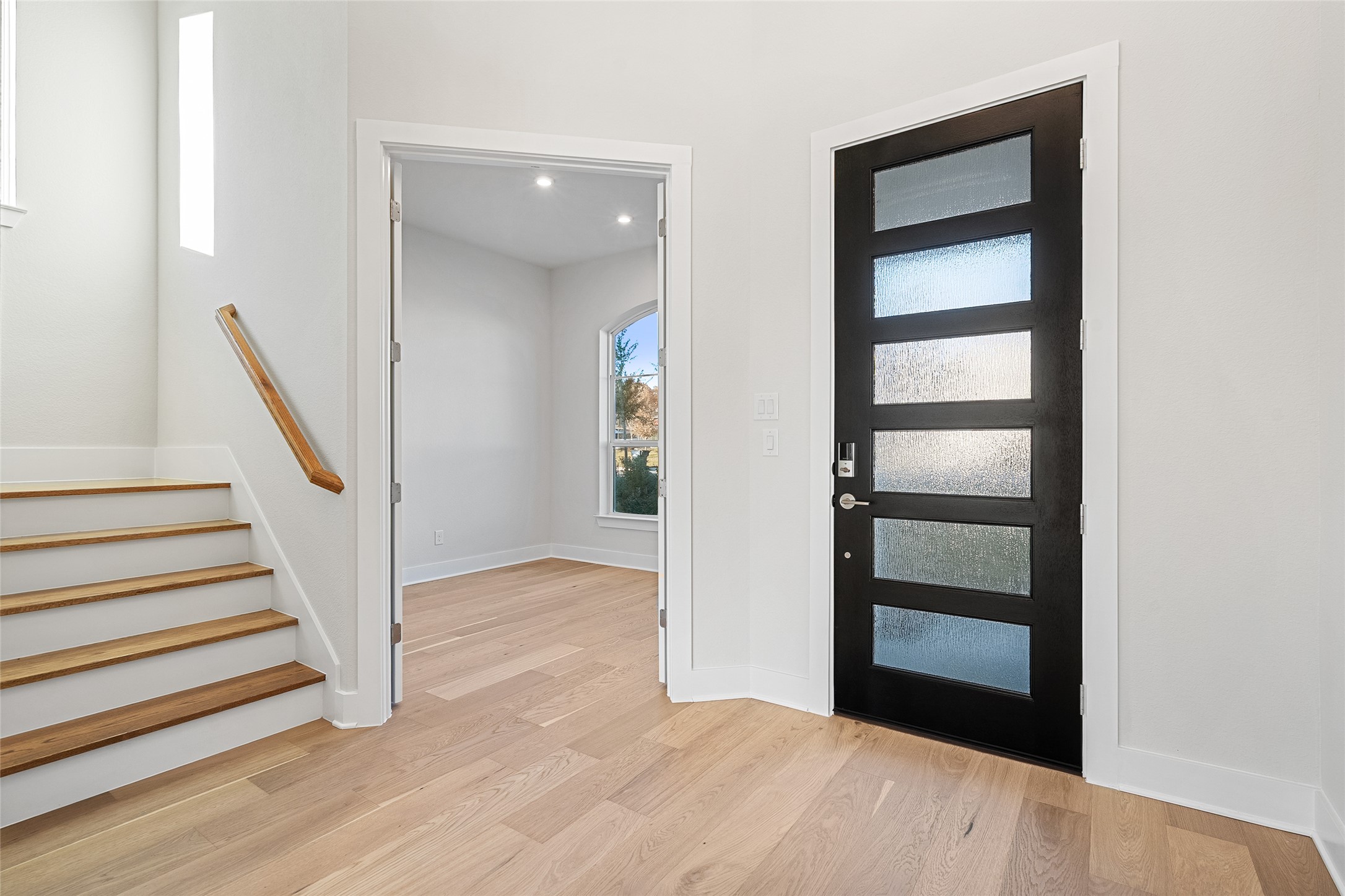 5336 Cosenza Trace Leander, TX 78641 - Photo 4 of 40 Entrance foyer featuring stairs, light wood-type flooring, and recessed lighting