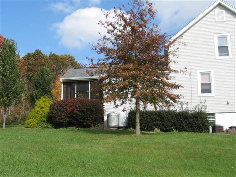 5569 Riner Road Riner, VA 24149 - Photo 22 of 24 a front view of a house with a garden